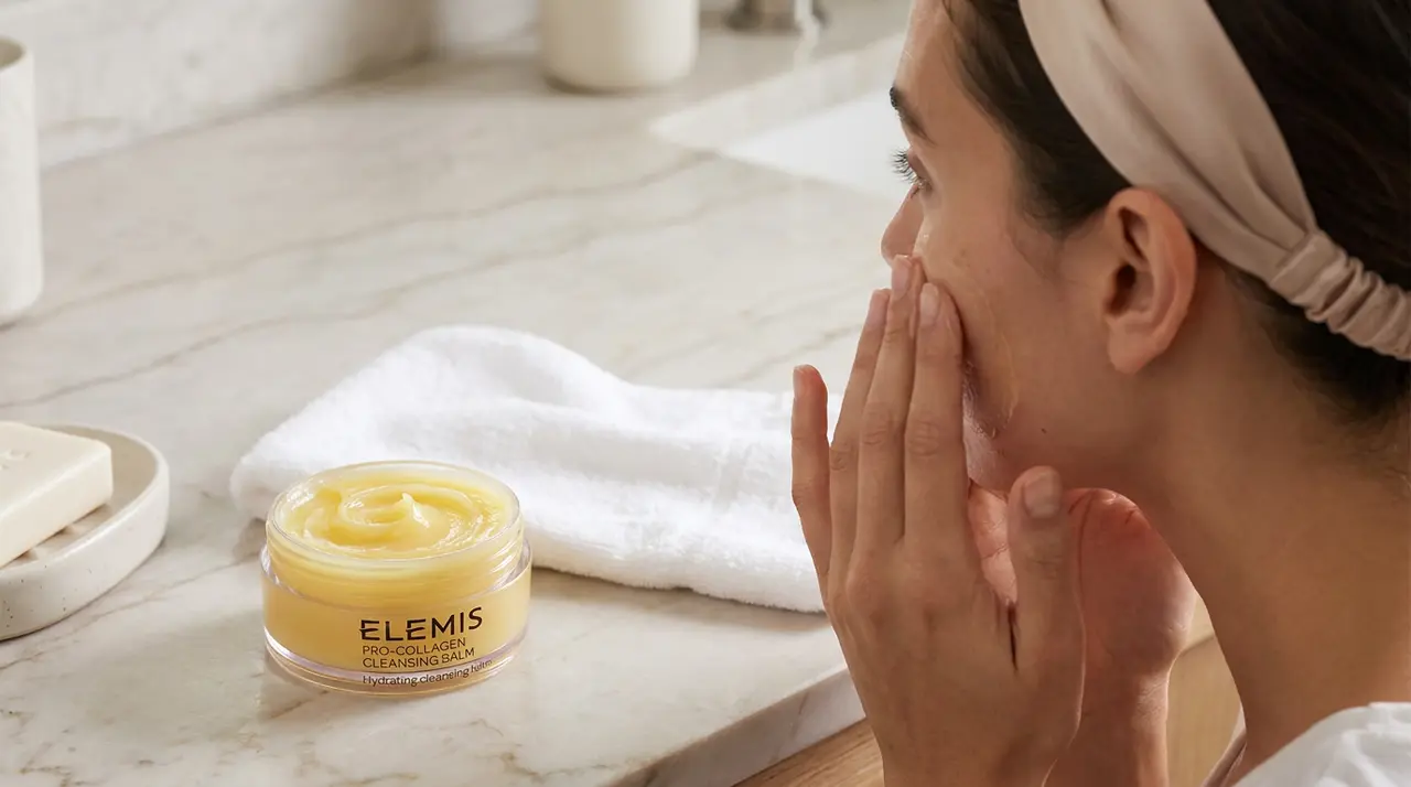Applying ELEMIS Pro-Collagen Cleansing Balm to the face